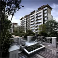 Modern Style Multi Story Apartment Building With Lush Green Garden And Pathways