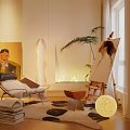 Comfortable Lounge Chair In Modern Living Room With Artwork Plant And Floor Lamp