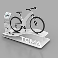Modern Display Shelf With Bicycle Display Sign And TOMA Branding