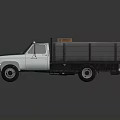 Green Vintage Utility Pickup Truck With Open Bed Carrying Cargo Boxes