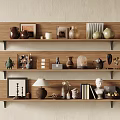 Decorative Ornament Arrangement on Wooden Shelves with Ceramic Jars Photo Frames and Sculptures