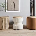 Stylish Modern Interior With Three Unique Wooden Stools Perforated Wavy And Ribbed Designs