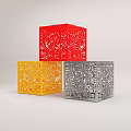 Colorful Cube Sculptures With Hollow Carved Patterns In Red Yellow And Silver