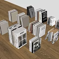 Assorted Books And Magazines Scattered On Wooden Floor With Various Colors And Sizes