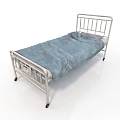 Metal Frame Hospital Bed With Blue Blanket And Wheels On White Background
