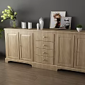 Wooden Sideboard with Vases Cups Artwork and Green Plant in Modern Interior