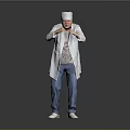 Man in White Chef Hat and White Coat with Blue Jeans Standing on Gray Background