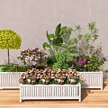 White Decorative Planters with Mixed Flowers and Green Plants for Outdoor Garden Decoration