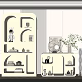 Modern Light Colored Decorative Cabinet With Various Shaped Shelves And Decorative Items