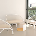 Modern Wicker Sofa Coffee Table Set With White Frame Beige Cushions And Natural Light
