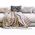 Cozy Modern Living Room Multi Seater Sofa With Striped Blanket And Patterned Pillows