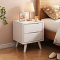White Bedside Table with Two Drawers Wooden Lamp Candle and Photo Frame