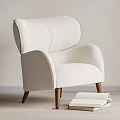 Modern White Single Sofa With Arched Back Wooden Legs And Books