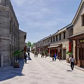 Traditional Chinese Commercial Street Featuring Brick Architecture Wooden Door Signboard And Greenery