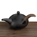 Black Cast Iron Teapots Placed On Wooden Tray For Traditional Tea Sets