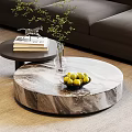 Round Marble Coffee Table With Bowl of Green Apples and Side Table With Books