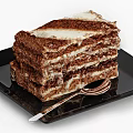 Layered Chocolate Cake with Creamy Layers on Black Plate and Silver Spoon Against Dark Cloth