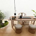 Chinese Wooden Tea Table With Round Cushioned Stools And Green Moss Plants