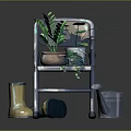 Green Plants in Decorative Flower Pots on Metal Folding Chair with Watering Can