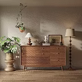 Modern Wooden Entryway Side Cabinet With Potted Plants Table Lamp And Framed Art