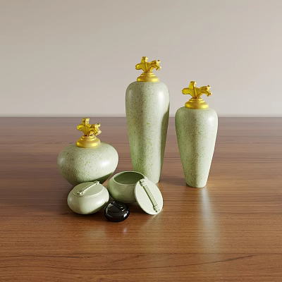 Light Green Ceramic Vessels with Gold Lids and Open Jar on Wooden Tabletop 3d model