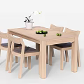 Wooden Dining Table Set With Four Chairs White Flower Pot Green Fruits And Black Plate