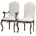 Elegant Dining Table Set With Intricate Carvings Black Tabletop And Silver Decorative Legs