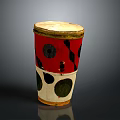 Homemade Traditional Snacks In Red White Black Patterned Cylindrical Container With Yellow Rim