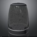 Modern Stainless Steel Cylindrical Electric Kitchen Appliance With Black Lid And Reflective Surface