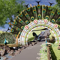 Peacock Feather Decorated Arched Entrance Gate With Grass Trees Stone Pathway And People Walking