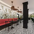 Hotel Lobby With Tropical Plant Murals Black White Geometric Flooring Green Banquette And Pendant Lights