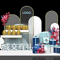 Promotion Event Setup With Golden Eggs Gift Boxes Floral Decor And LOGO