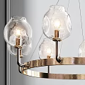 Elegant Gold Ring Chandelier With Clear Glass Globe Shades And Warm Lighting