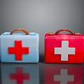 Two Colored First Aid Kits With Red White Crosses And Handles For Home Use