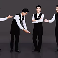 Group of Male Waiters in Black Vests and White Shirts With Various Serving Poses