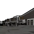 Charming Commercial Street Featuring Outdoor Cafes Pedestrians And Modern Shop Designs