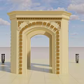 Beige Arched Entrance Gate With Intricate Carvings Set In Open Space Under Blue Sky