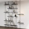 Decorative Ornaments Set on Black Multi Layered Shelf with Vases Sculptures Photo Frames and Books