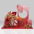 Creative Red Art Installation With Curved Structures Circular Frame And Floral Decorations On Geometric Base