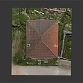 Old Two Story Building With Red Tile Roof Yellow Walls And Ruined Surrounding Grass
