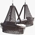 Comfortable Rattan Swing Chair With Soft White Cushions And Fringed Design