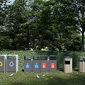 Outdoor Public Recycling Bins in Park Green Space With Trees and Sorted Waste