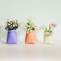 Colorful Decorative Vases Holding Pink Tulips White Flowers And Mixed Blooms On White Table