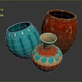 Three Decorative Ceramic Vases With Blue Red Patterns And Unique Designs