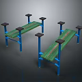 Two Outdoor Benches With Green Wooden Planks Blue Metal Frames And Black Support Blocks