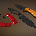 3D Rendered Tactical Knives With Black Orange Handles Red Parts And Metal Screws