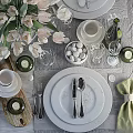 Elegant Tableware Set With White Plates Glassware Tulips Cups And Green Napkins