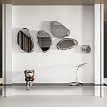 Modern Silver Irregular Mirrors as Wall Decor on White with Black Shelf Small Green Plant