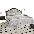 Double Bed With White Sheets Black Headboard And Bedside Tables On Polka Dot Rug
