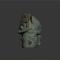 Ancient Bronze Beast Mask Sculpture Carving Featuring Symmetric Patterns And Greenish Patina